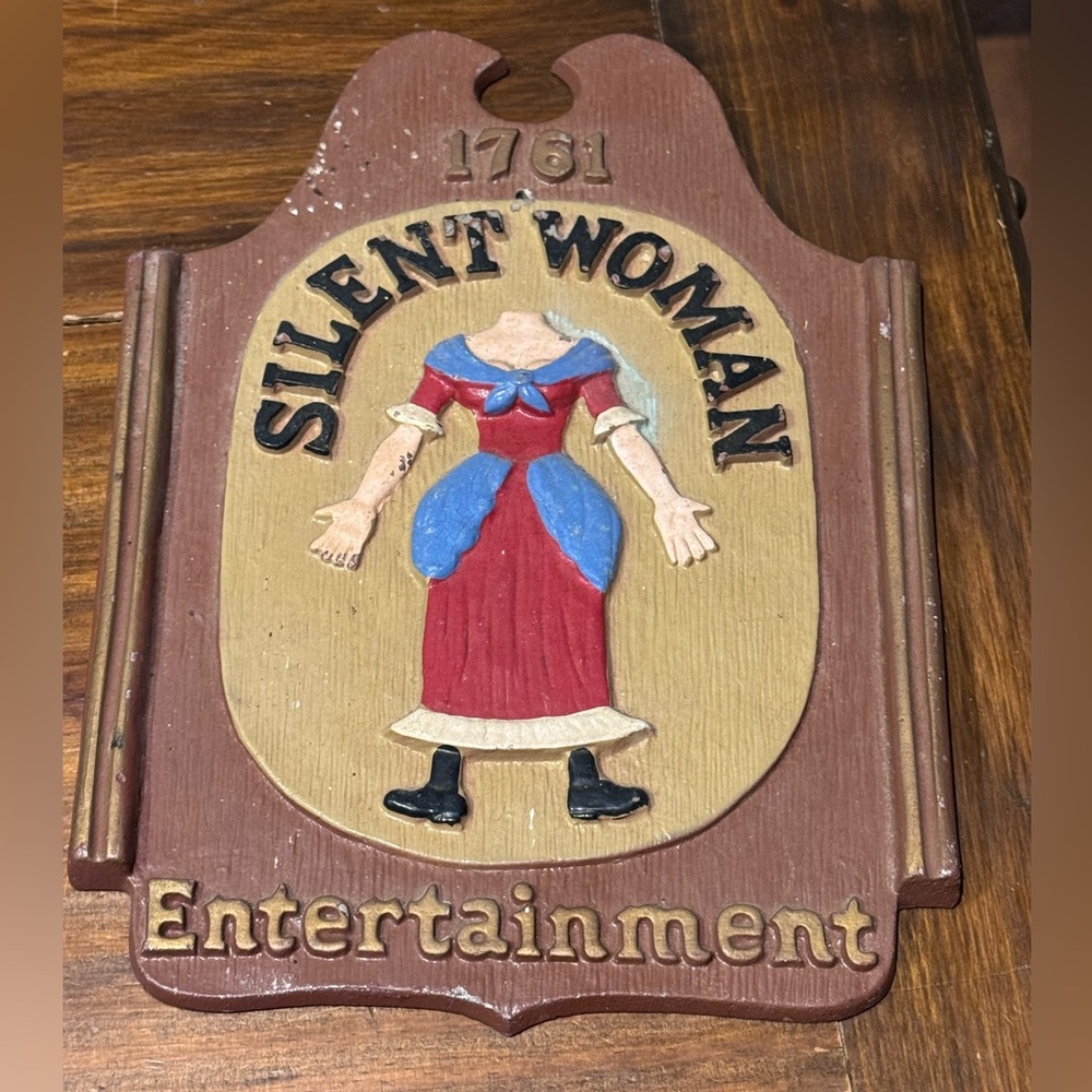 vintage metal wall plaque sign features Silent Woman Entertainment English pub